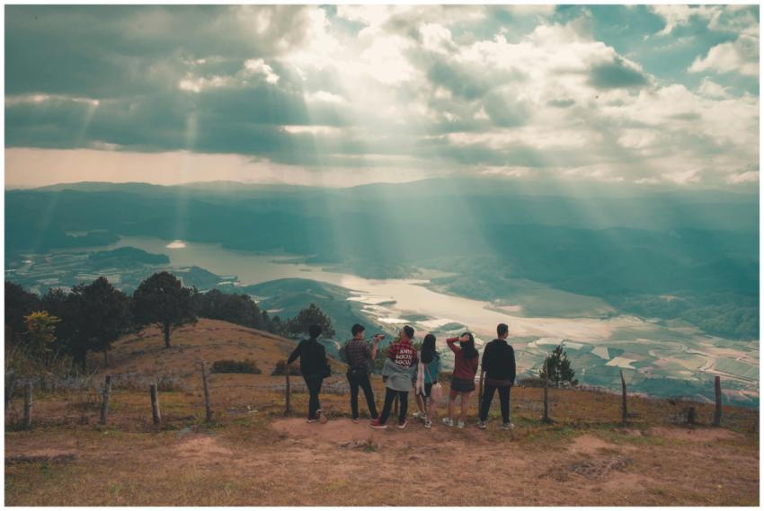 A group of people admire the beautiful valley and
