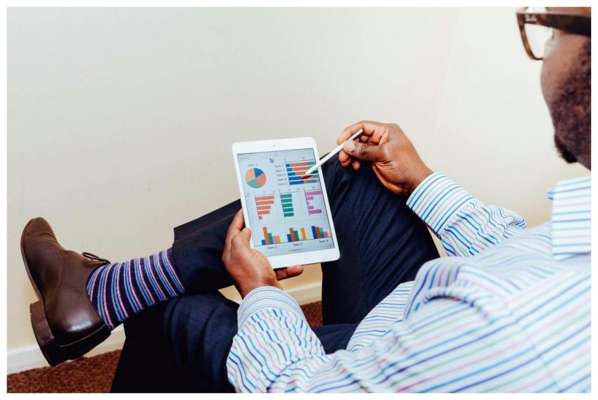 Businessman using a tablet for data analysis in a