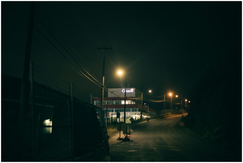 Moody nighttime urban scene featuring a dimly lit