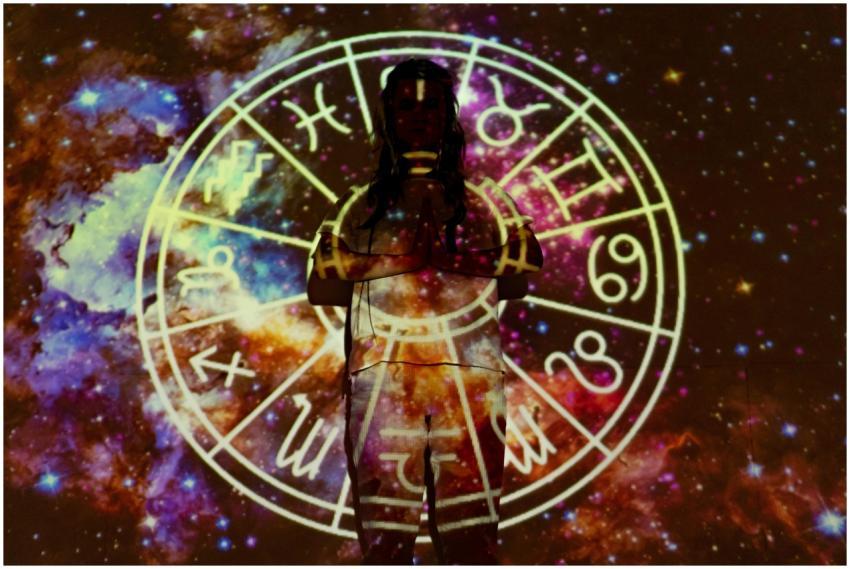 Silhouette of a person with celestial astrology sy