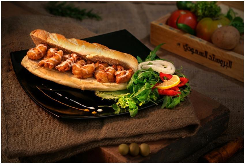 Appetizing chicken sandwich paired with a fresh sa