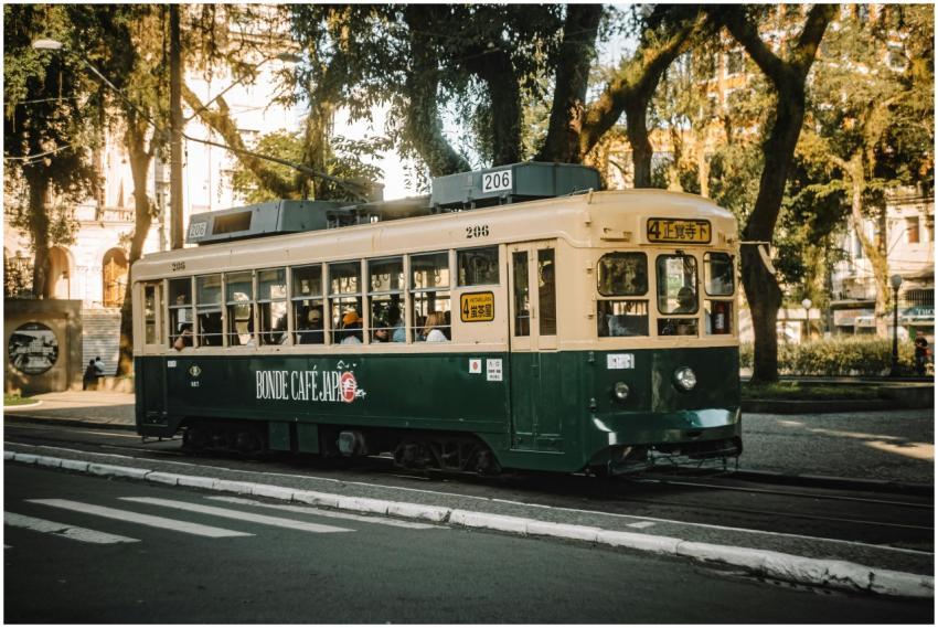 Colorful vintage tram in a serene urban space surr