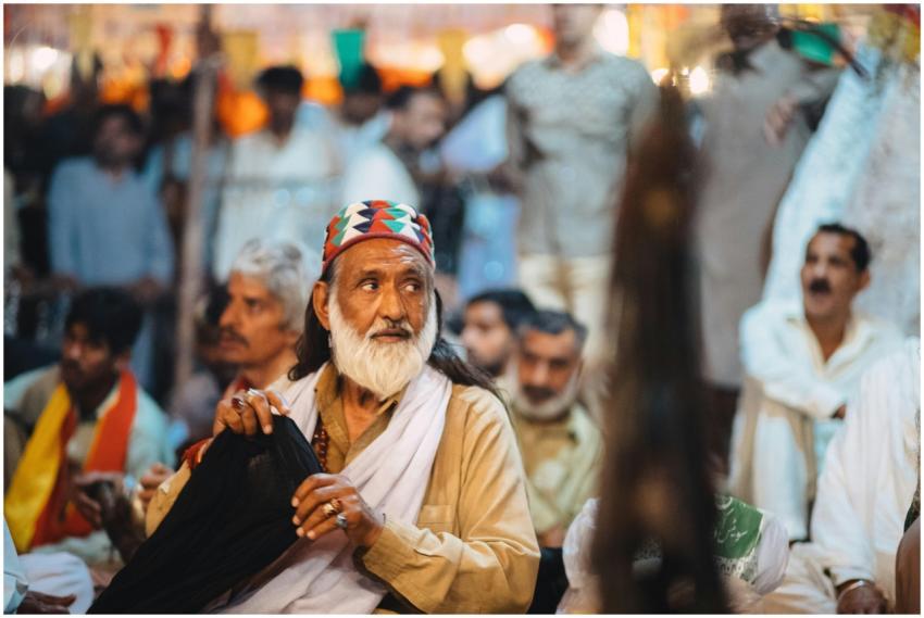 Close-up of a man in traditional attire at a cultu