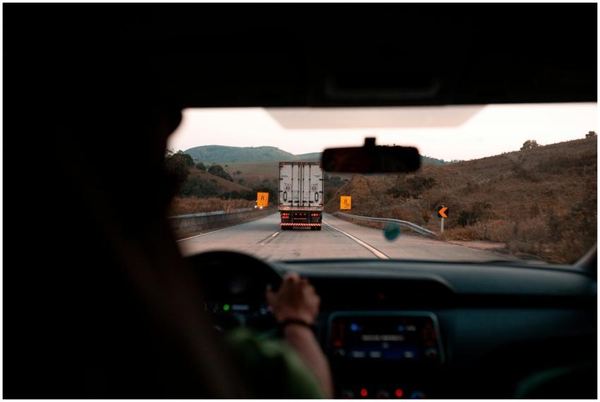 Scenic drive with a truck on a highway surrounded