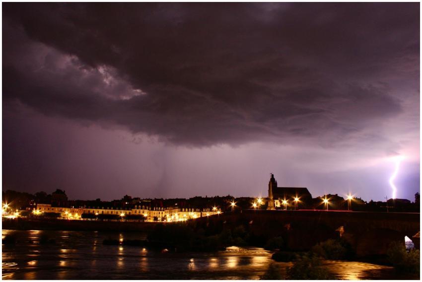 Dramatic nighttime scene with lightning illuminati
