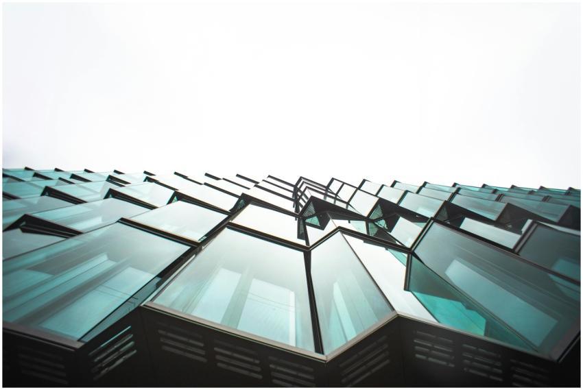 Low angle view of a modern building's glass facade