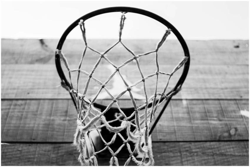 Low angle of black and white basketball mesh net a