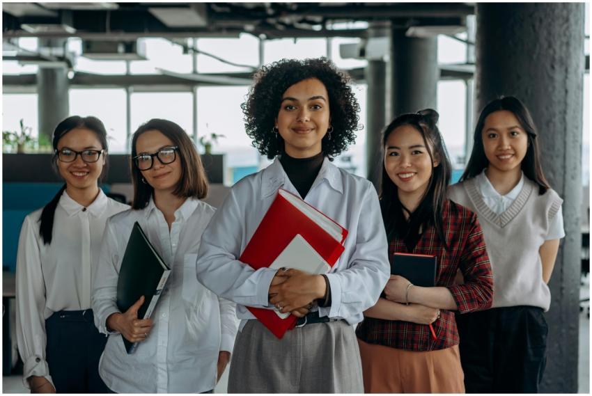 Group of diverse women colleagues smiling in a mod