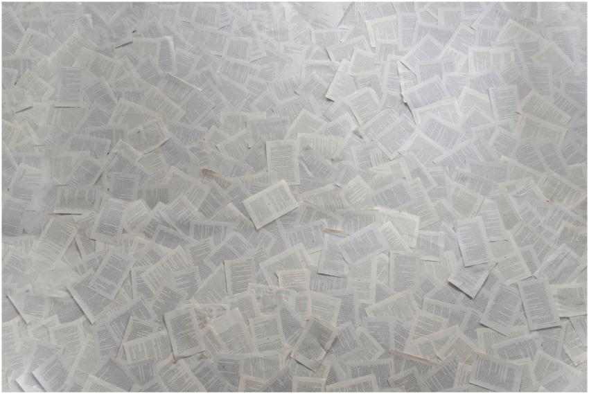 Abstract composition of numerous loose book pages