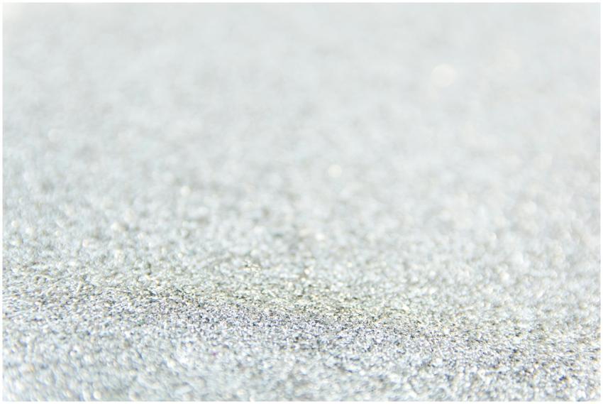 Close-up of defocused silver glitter creating a sp