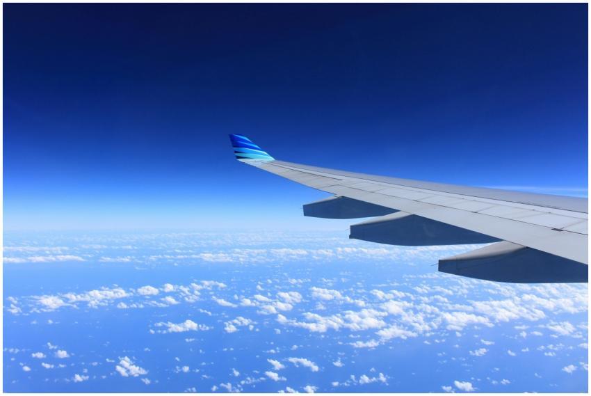 Scenic view of an airplane wing flying high above