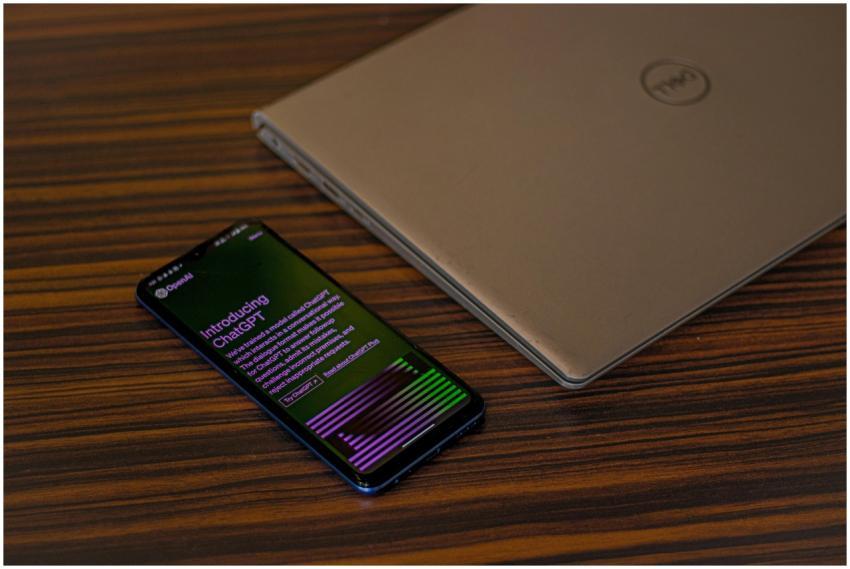 A smartphone displaying ChatGPT app beside a close