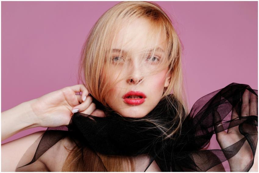 Close-up fashion portrait of a woman with blond ha