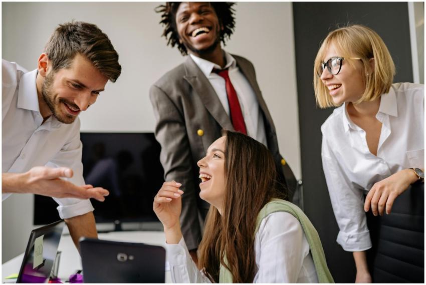 A diverse group of professionals enjoying a light-