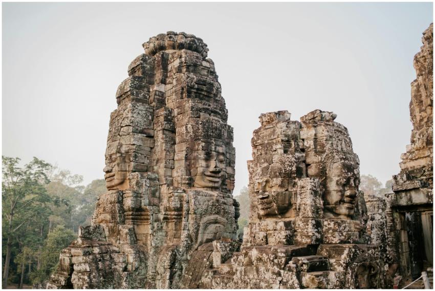 Ancient stone faces of Bayon Temple, a historic Kh