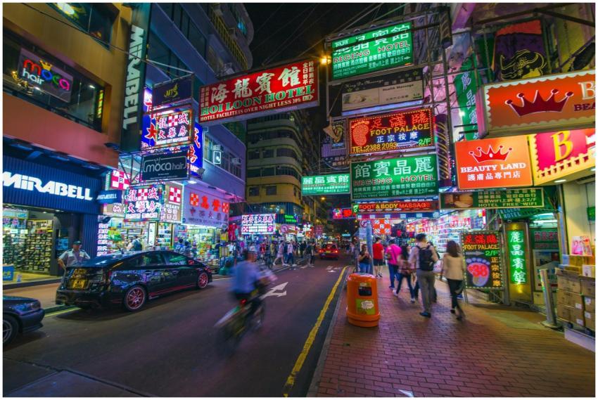 Explore the vibrant neon-lit streets and bustling