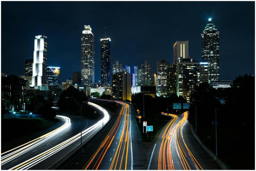 A vibrant cityscape at night showcasing light trai