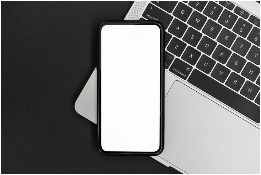 Minimalist workspace featuring a smartphone and la