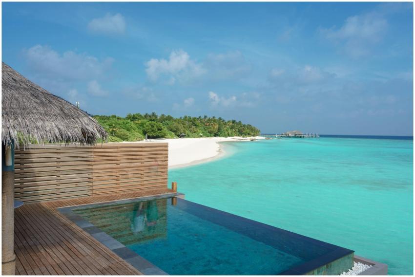 Stunning beachside view with an infinity pool, cle