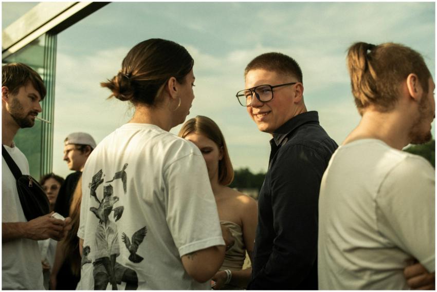 Group of people enjoying a relaxed outdoor gatheri
