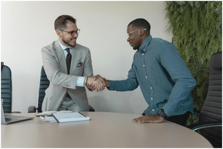 Two men shaking hands during a professional busine