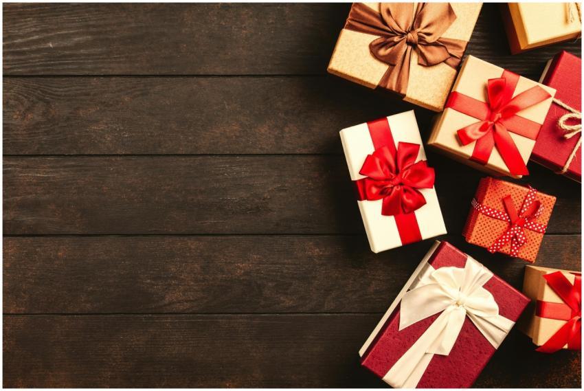 Beautifully wrapped holiday gifts with ribbons on