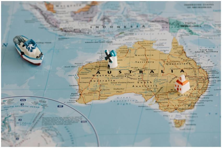 Miniature windmill and ship placed atop a map of A