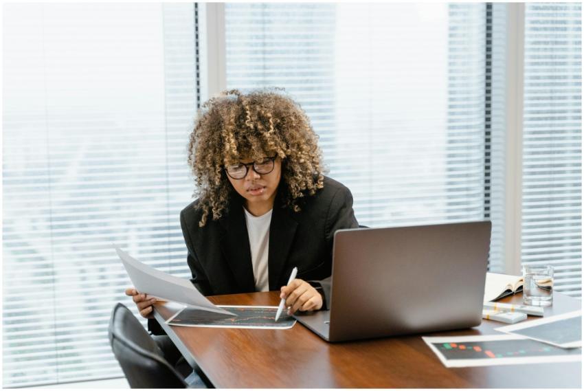 A young professional analyzing financial charts at