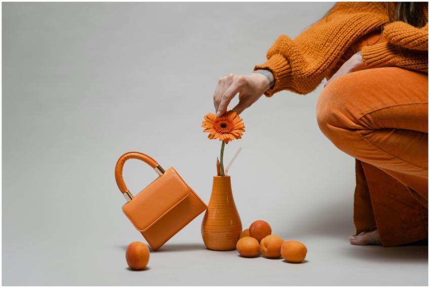 A minimalist composition featuring a woman arrangi