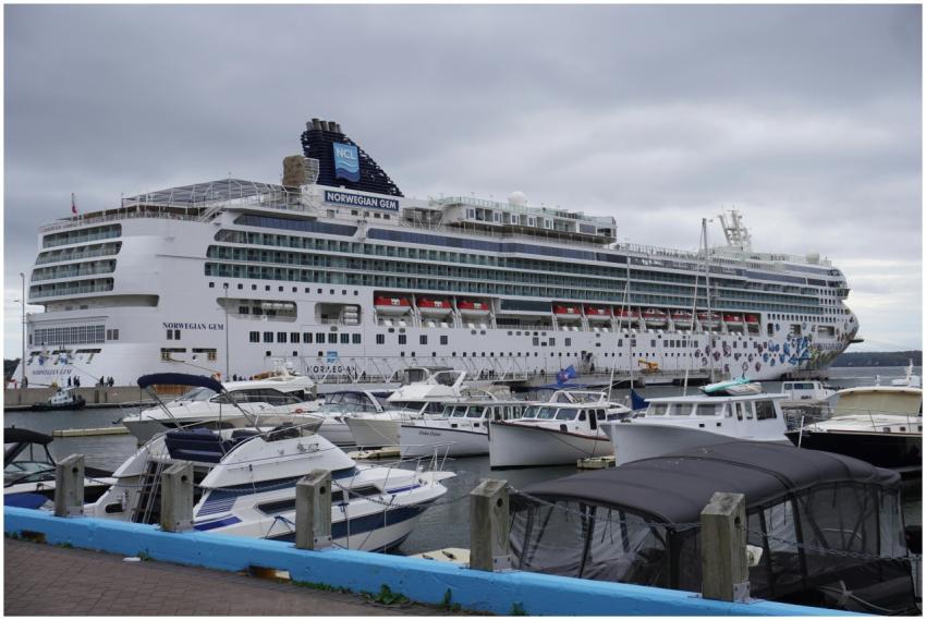 Large Norwegian Gem cruise ship docked at a harbor