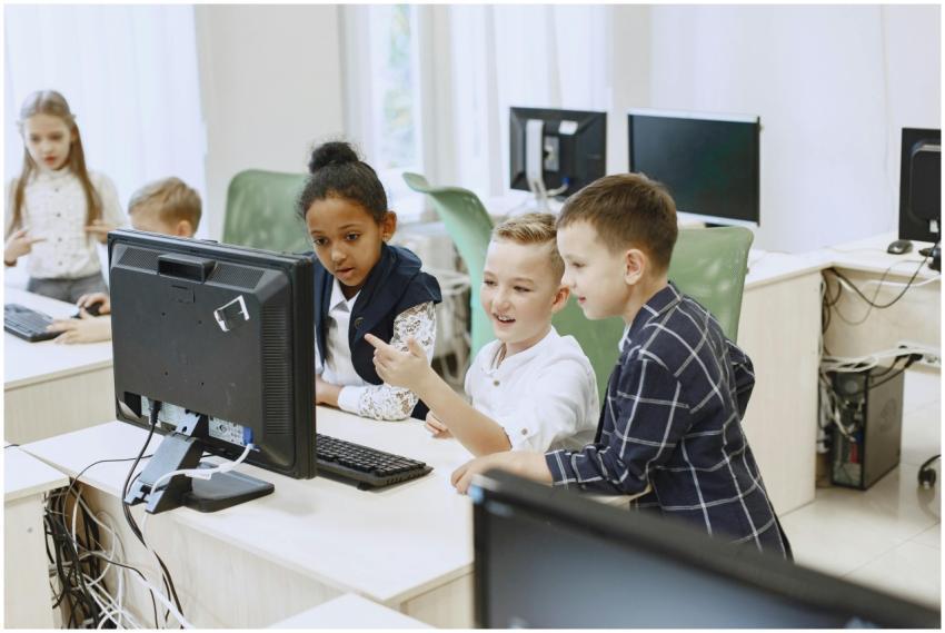 Young students engaging with computers in a modern