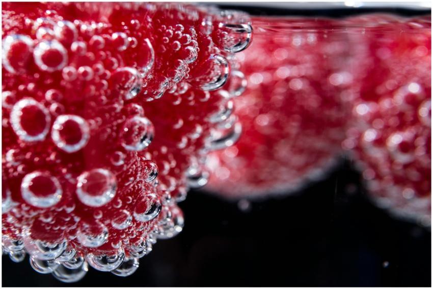 Detailed shot of vibrant red fruit with hydration