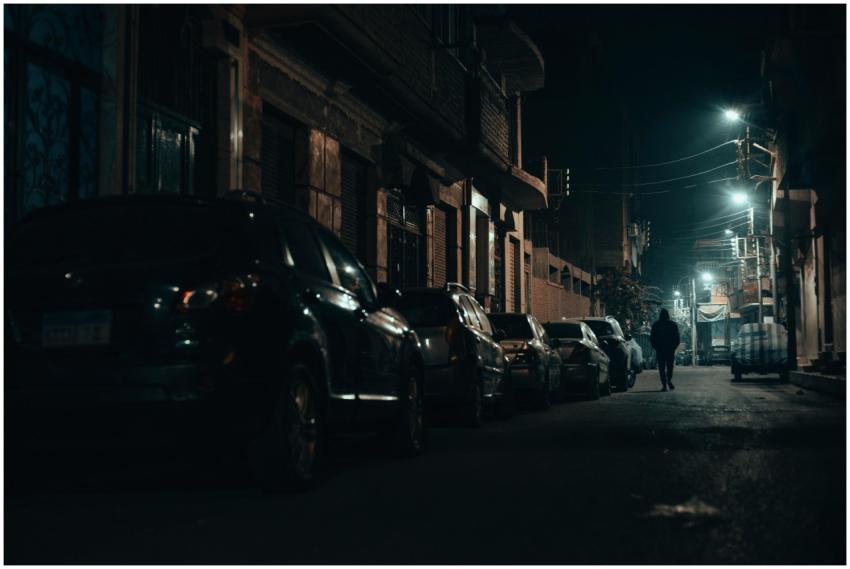 Dramatic nighttime street view in Qena, Egypt with