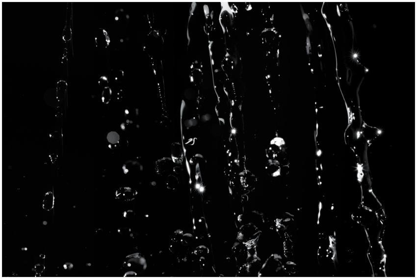 Detailed close-up of water droplets splashing on a