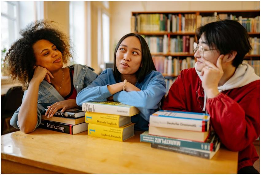 Three diverse students studying together in a univ