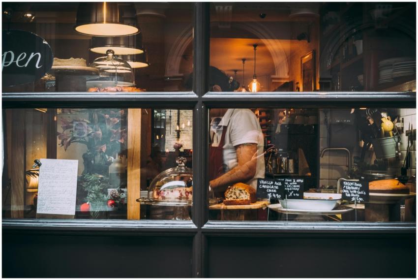 Warm bakery scene in London through window showcas