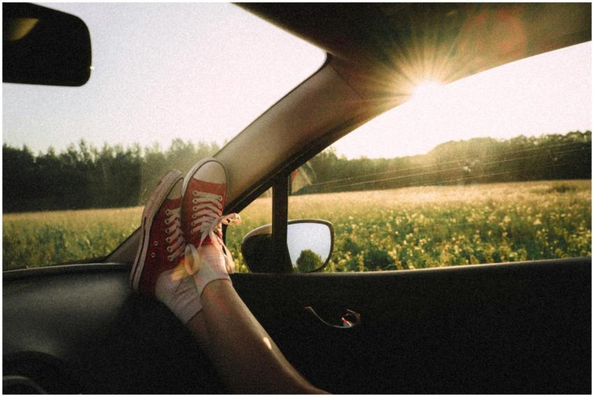 Feet propped up on car dashboard with scenic count