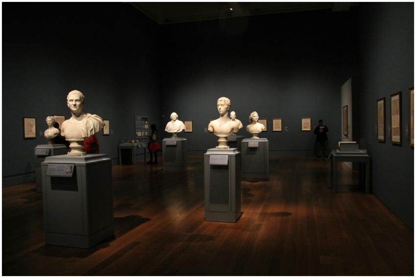 An art gallery with classical sculptures and frame