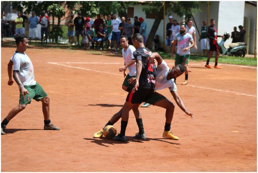 Players engage in a competitive soccer match on an