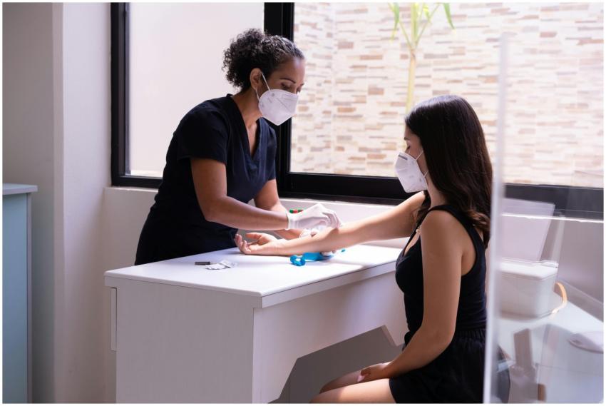 A healthcare professional wearing a face mask perf