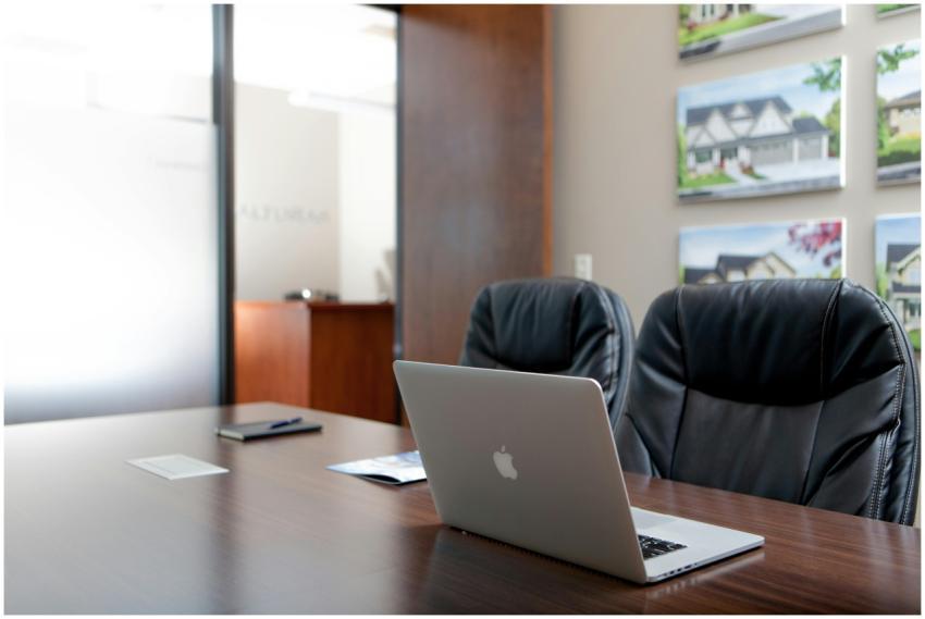 Sleek modern office interior featuring a laptop an