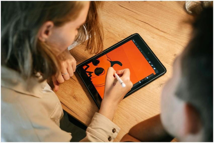 Two people creating a Halloween-themed digital ill