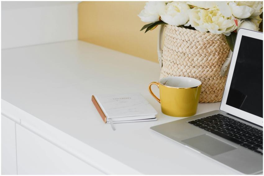 Elegant home workspace setup with a yellow mug, la