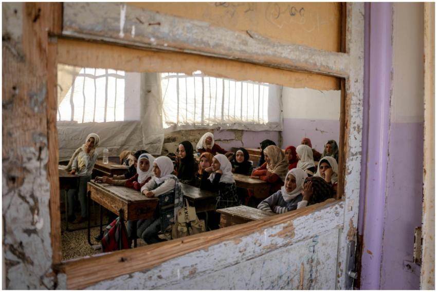 Middle Eastern children attending school in a clas