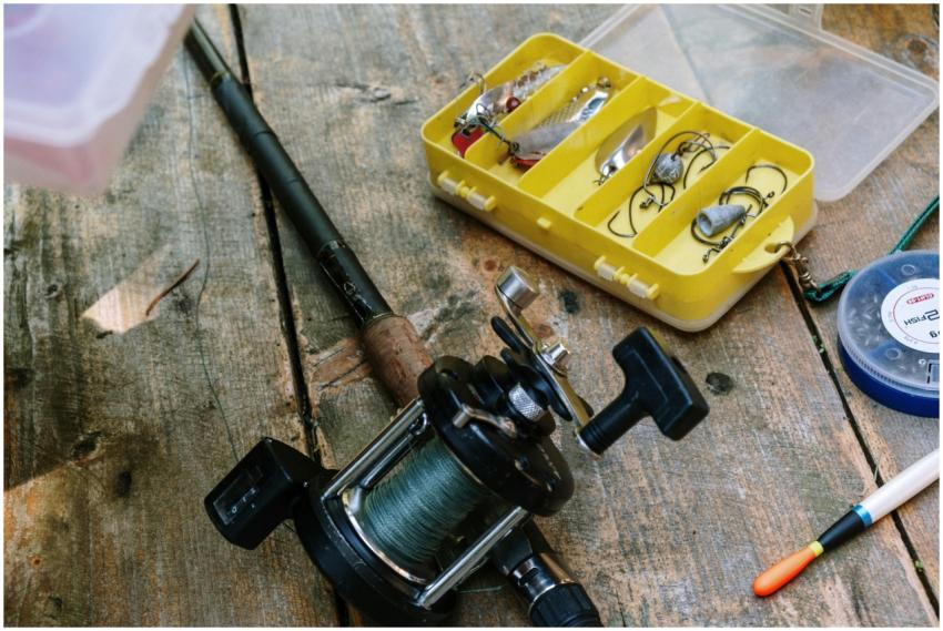 Close-up of fishing gear, including rod, reel, and