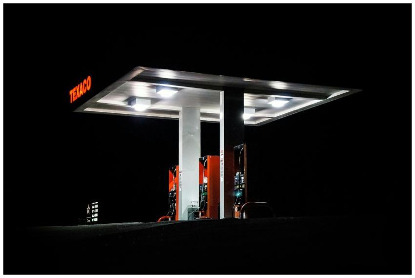 Night view of a Texaco gas station brightly illumi