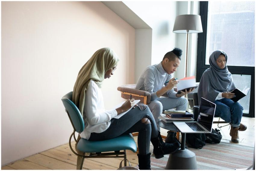 A diverse group of young adults working collaborat