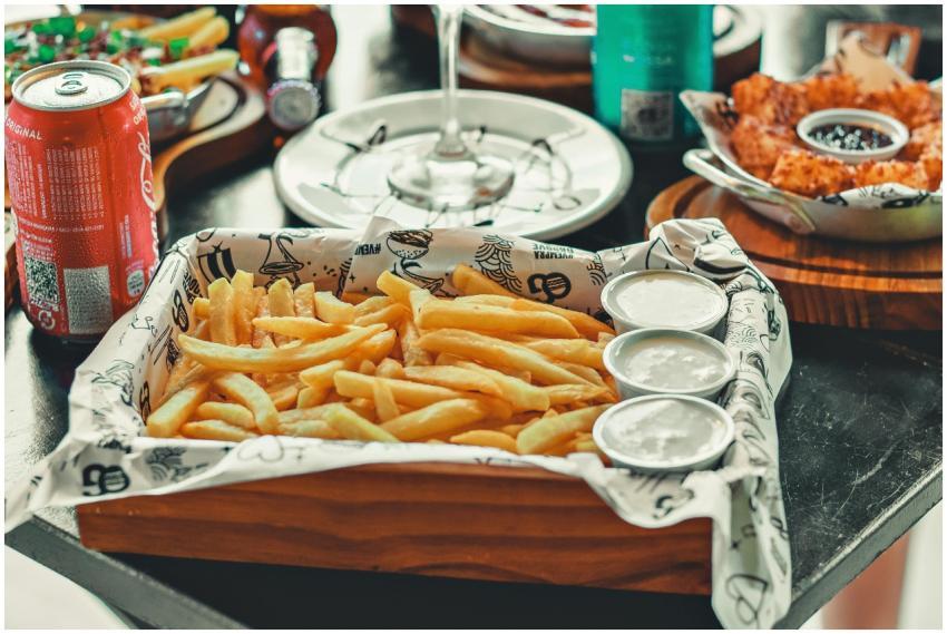 A tempting tray of french fries with dipping sauce