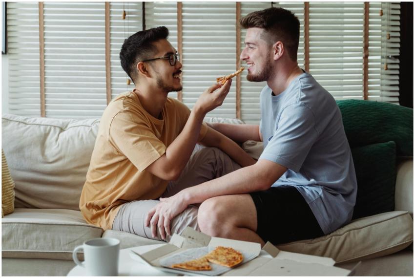 Happy interracial LGBT couple enjoying each other'