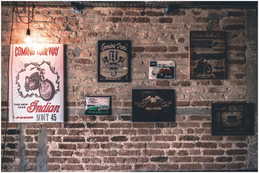 Retro wall art featuring motorcycle and car signs